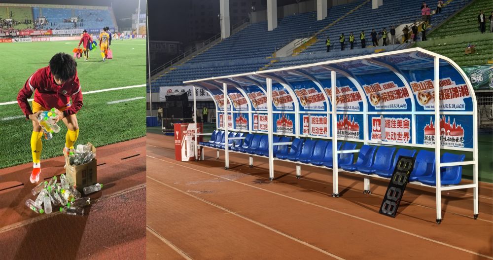 9月26日，张家界队球员在赛后清扫水瓶与张家界队赛后替补席拼图。新华社记者 谭畅 摄